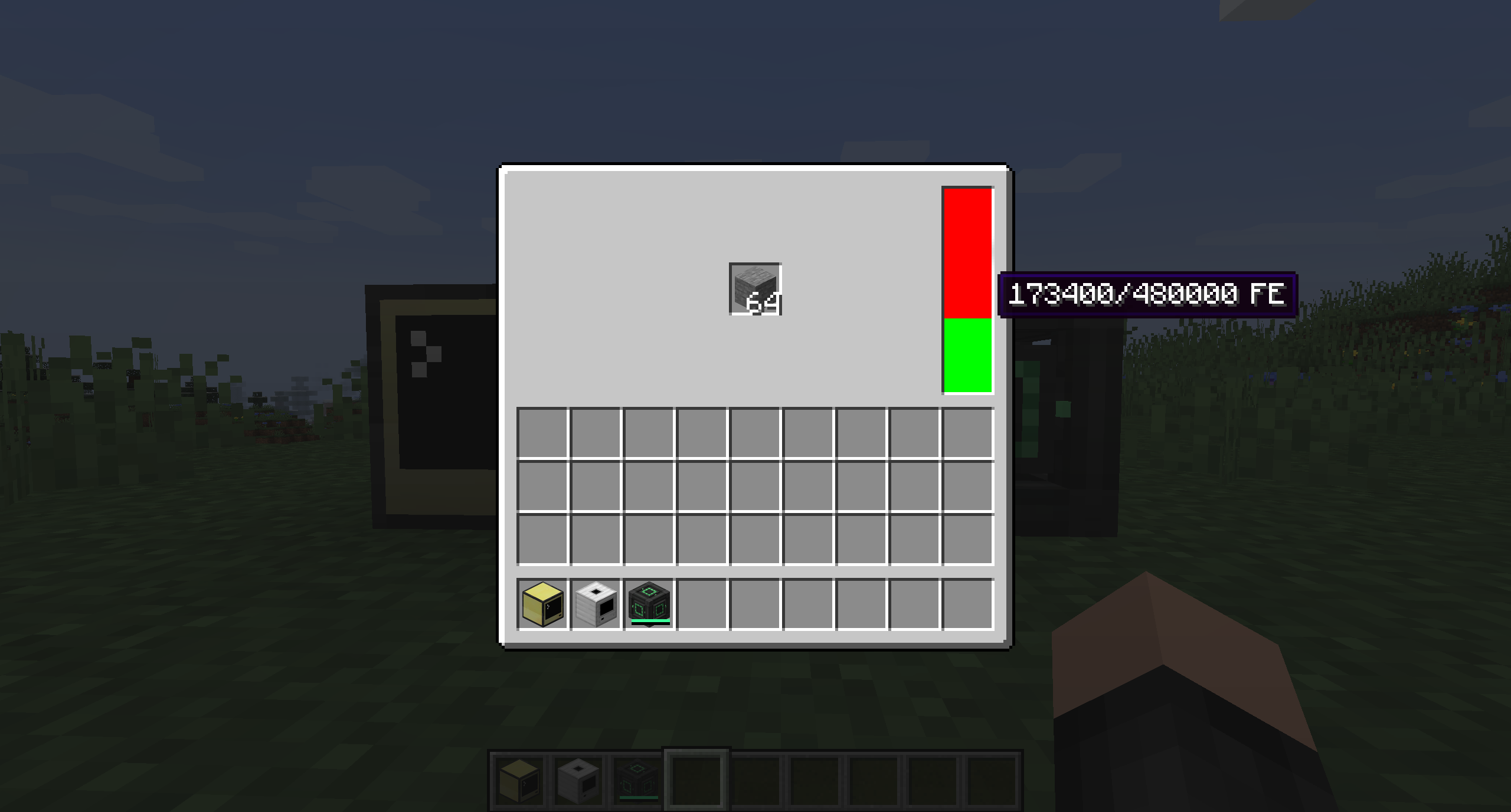 The gui of the digitizer. The player inventory and a single slot above it containing 64 stone.
On the right side is an energy indicator in the form of a bar with red and green color indicating the stored energy.
The cursor is hovering above the bar and the Tooltip "173400/480000FE" is shown.